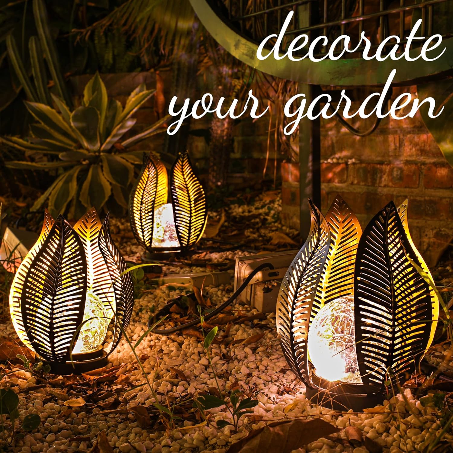 QZGE solar garden lights with waterproof crackle globe glass and metal palm design illuminating outdoor yard decoration.