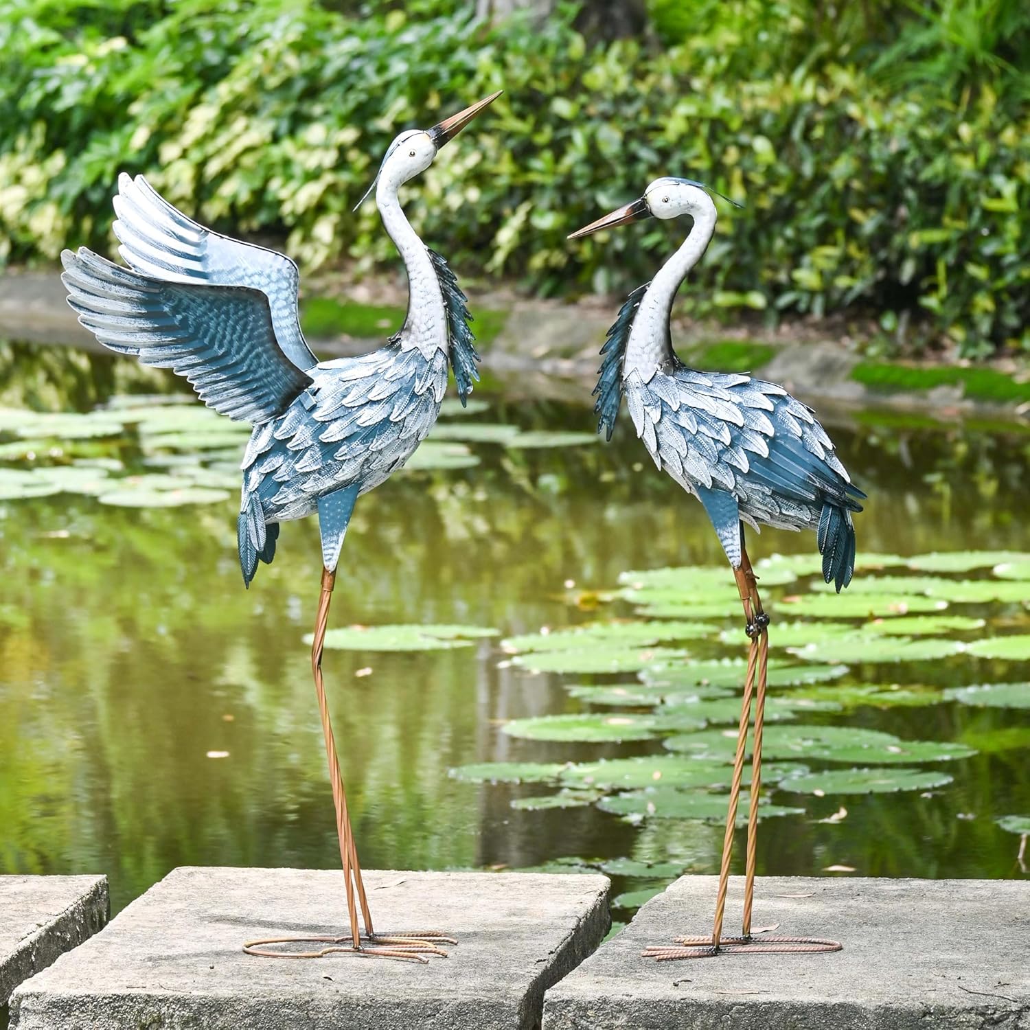 Set of 2 TERESA'S COLLECTIONS heron garden decor statues featuring elegant bird designs for outdoor landscaping.