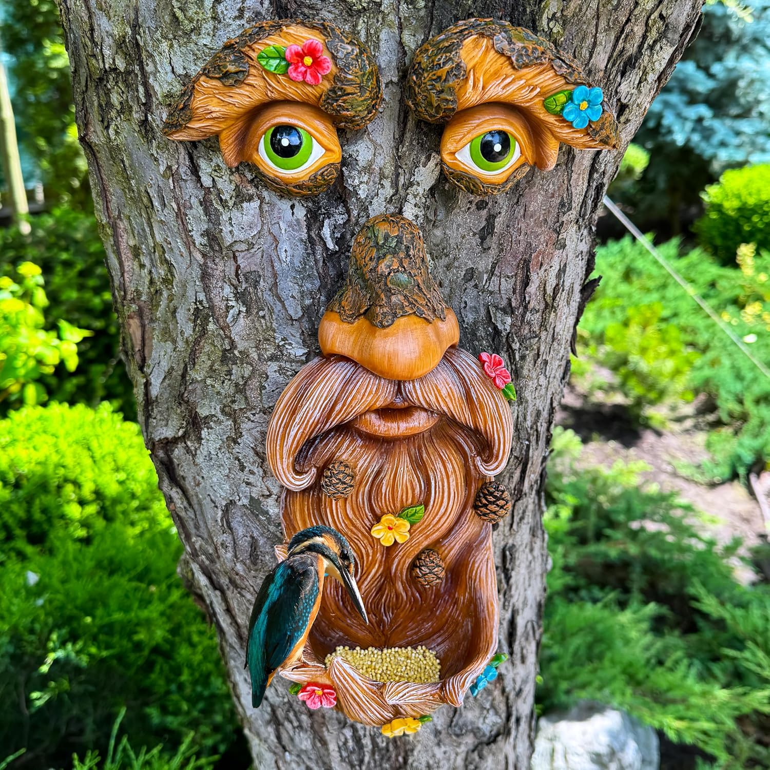 Outdoor bird feeder with old man face decoration from Mood Lab, featuring a tree face design for garden decor.