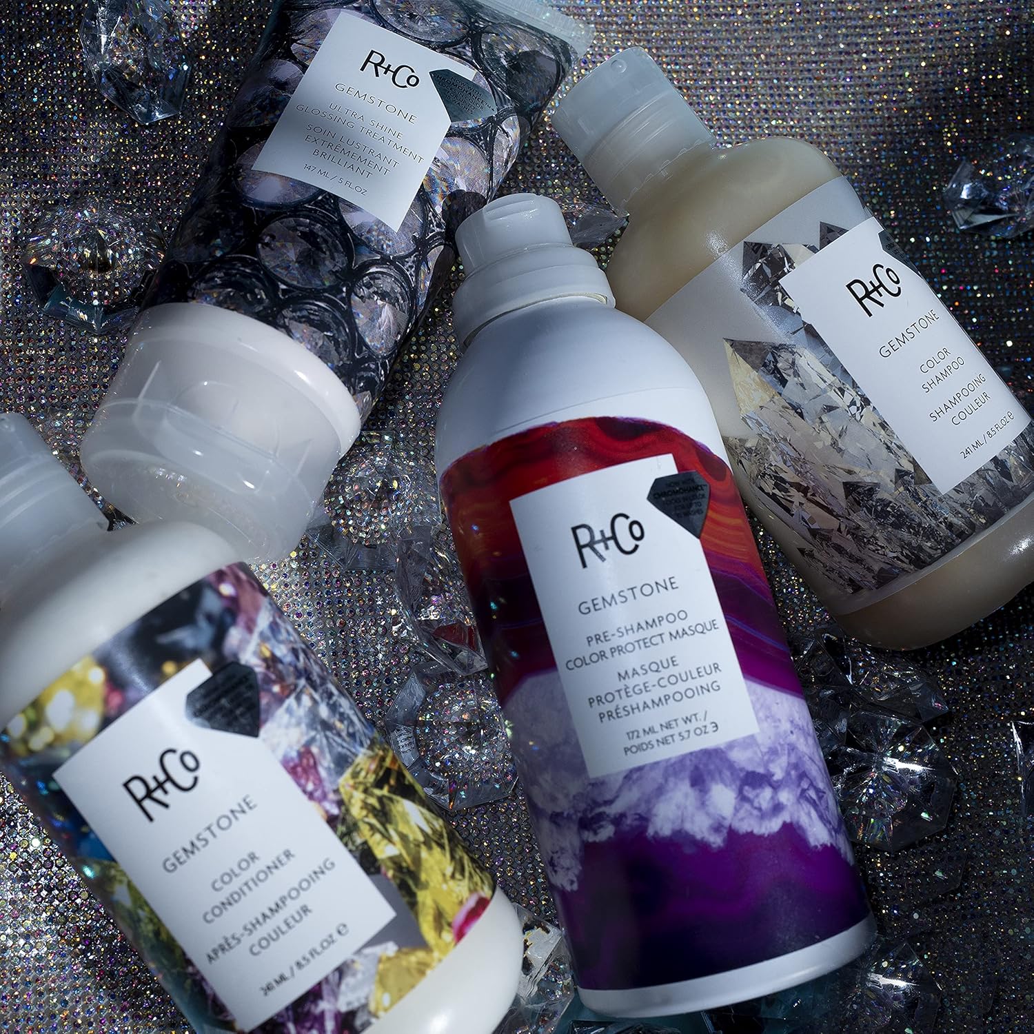 R+Co Gemstone Ultra Shine Glossing Treatment in 147 ml bottle, featuring sleek packaging and glossy finish for vibrant hair shine.