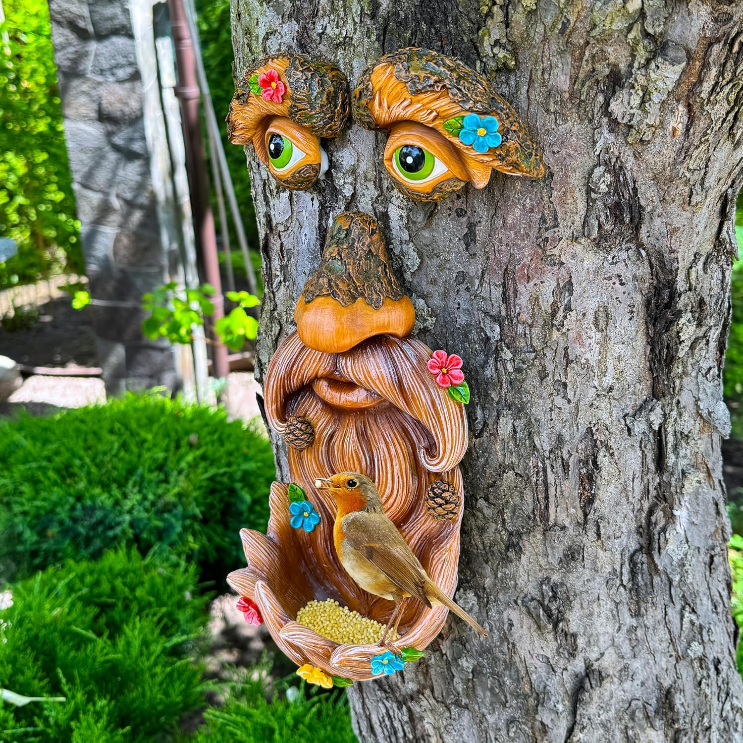 Mood Lab tree face decor outdoor bird feeder featuring an old man face design, adds whimsical charm to garden or backyard.