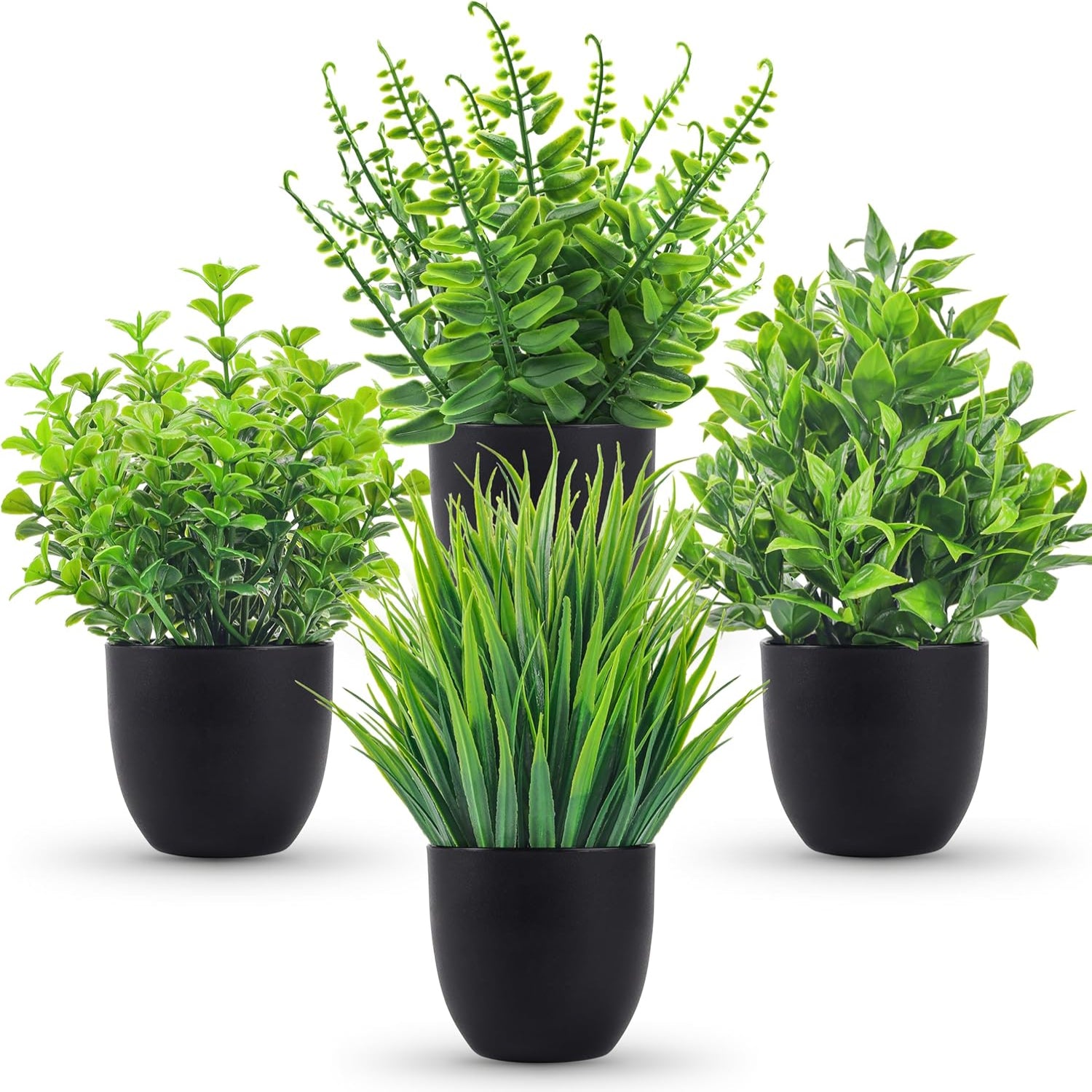 Set of four artificial plants in black pots on a white background