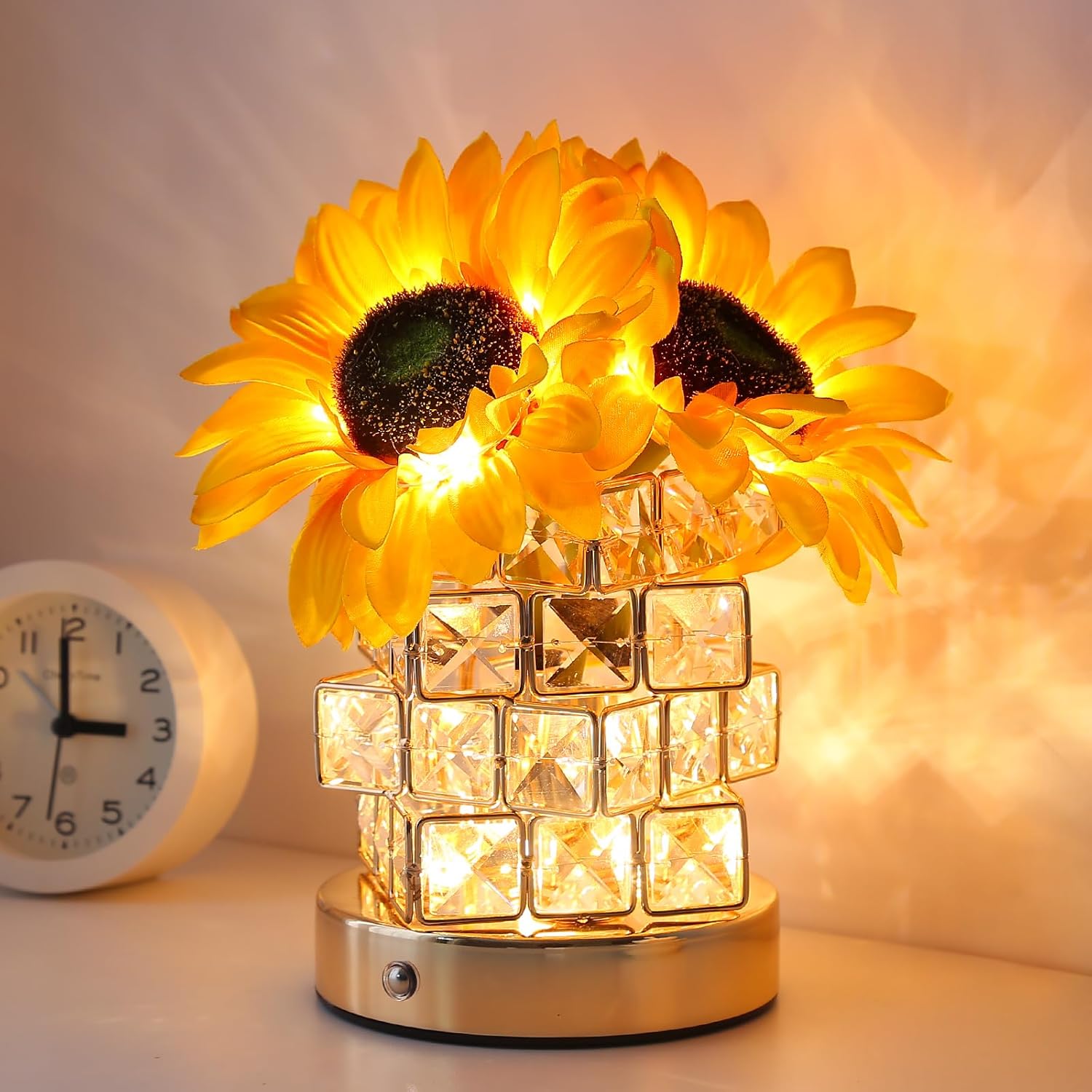 Decorative lamp with sunflower design and crystal base on a soft background