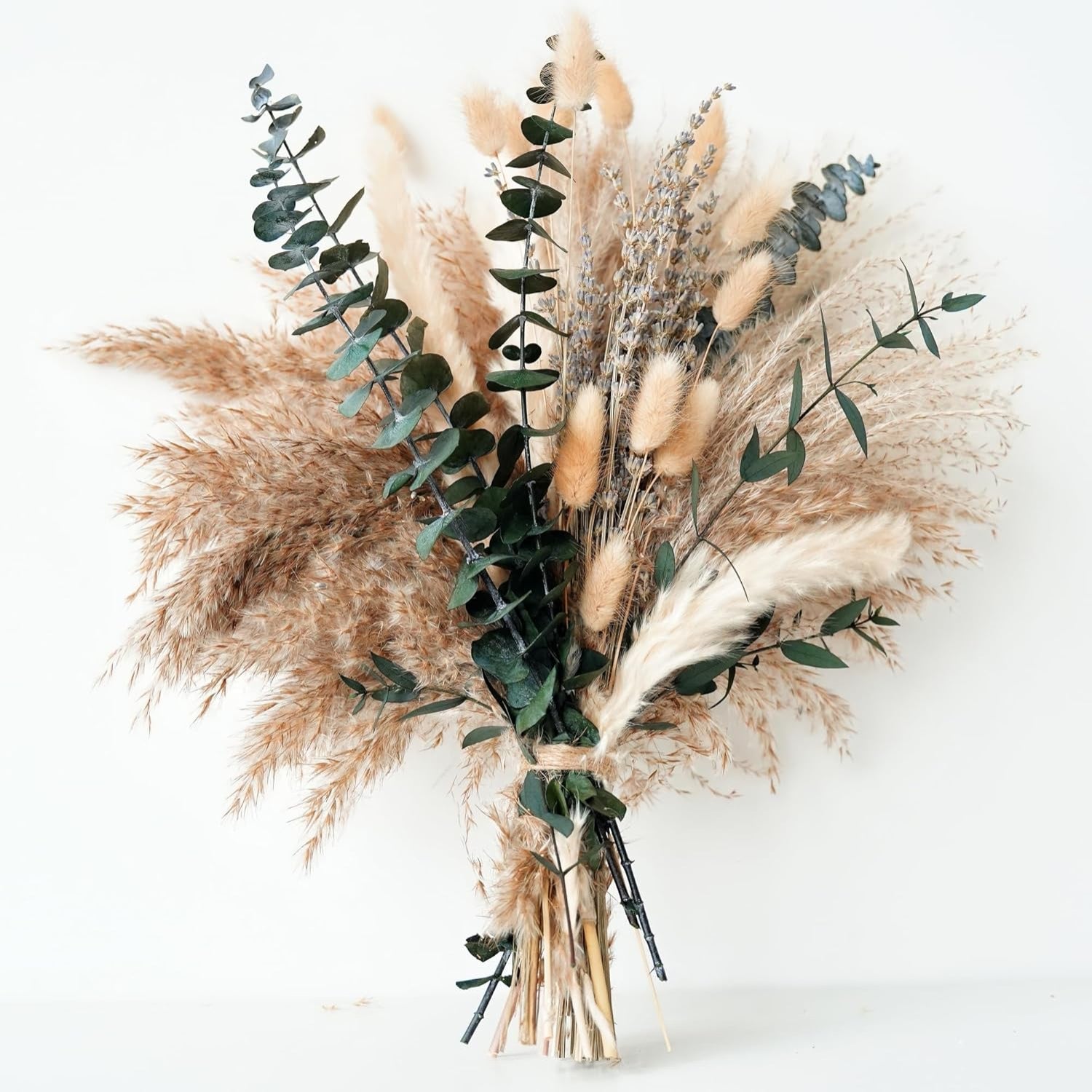 Bouquet of dried pampas grass and eucalyptus on a white background