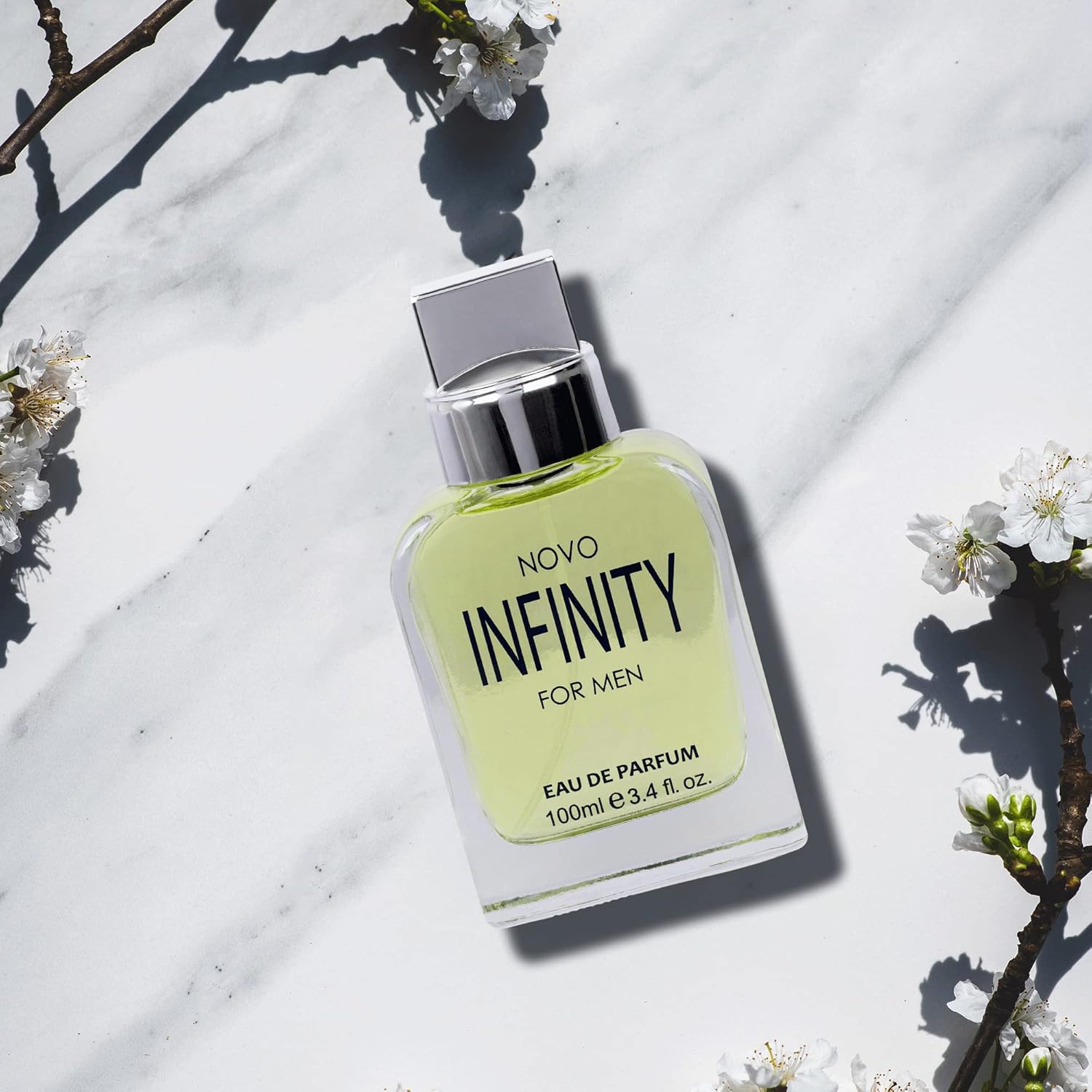 NovoGlow Novo Infinity men's eau de parfum spray bottle, 3.4 fl oz, with sleek packaging and black cap.