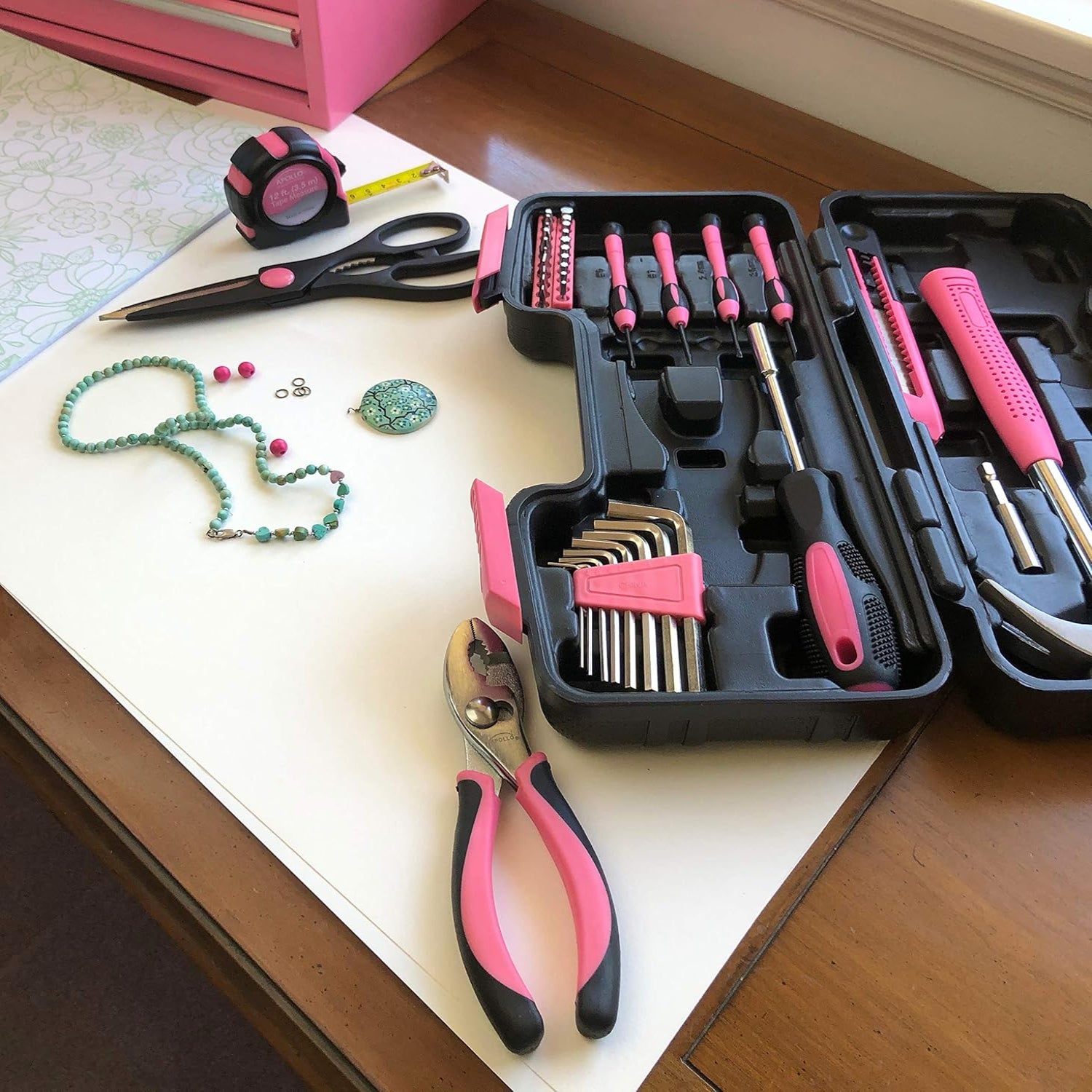 Apollo Tools 39-piece general household tool set in a plastic toolbox with screwdrivers, pliers, wrenches, and other hand tools.