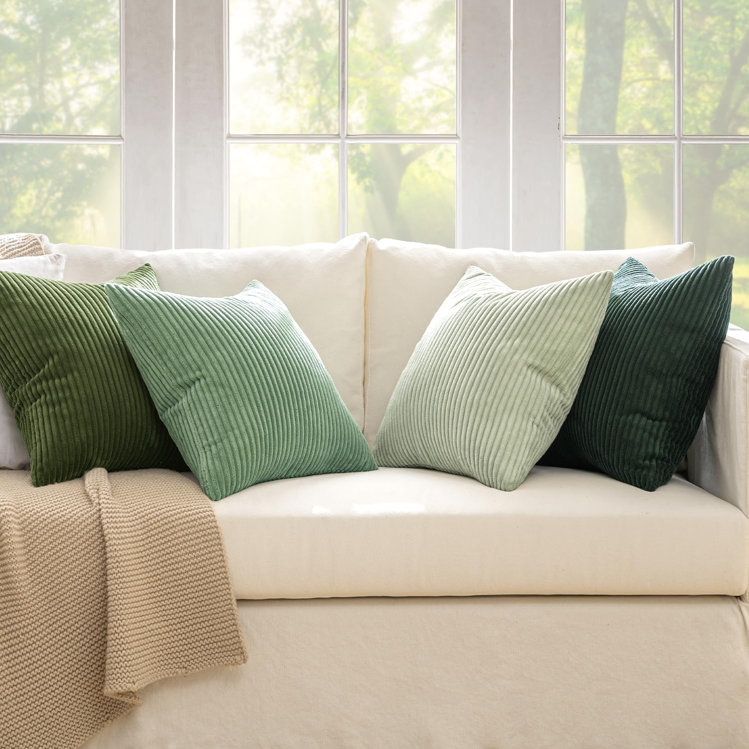 Set of four MIULEE boho farmhouse sage green throw pillow covers, 18x18 inches, with modern design and textured fabric.