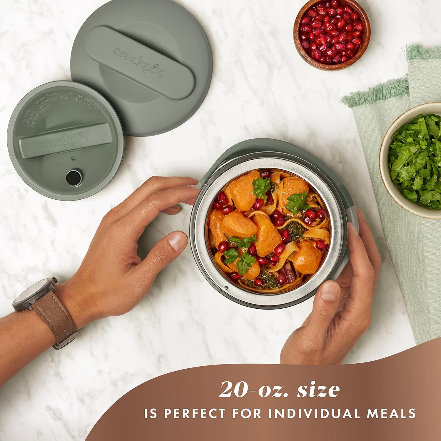 Crock-Pot portable electric lunch box in moonshine green with 20-ounce food warmer and carrying handle, suitable for warm meals on the go.