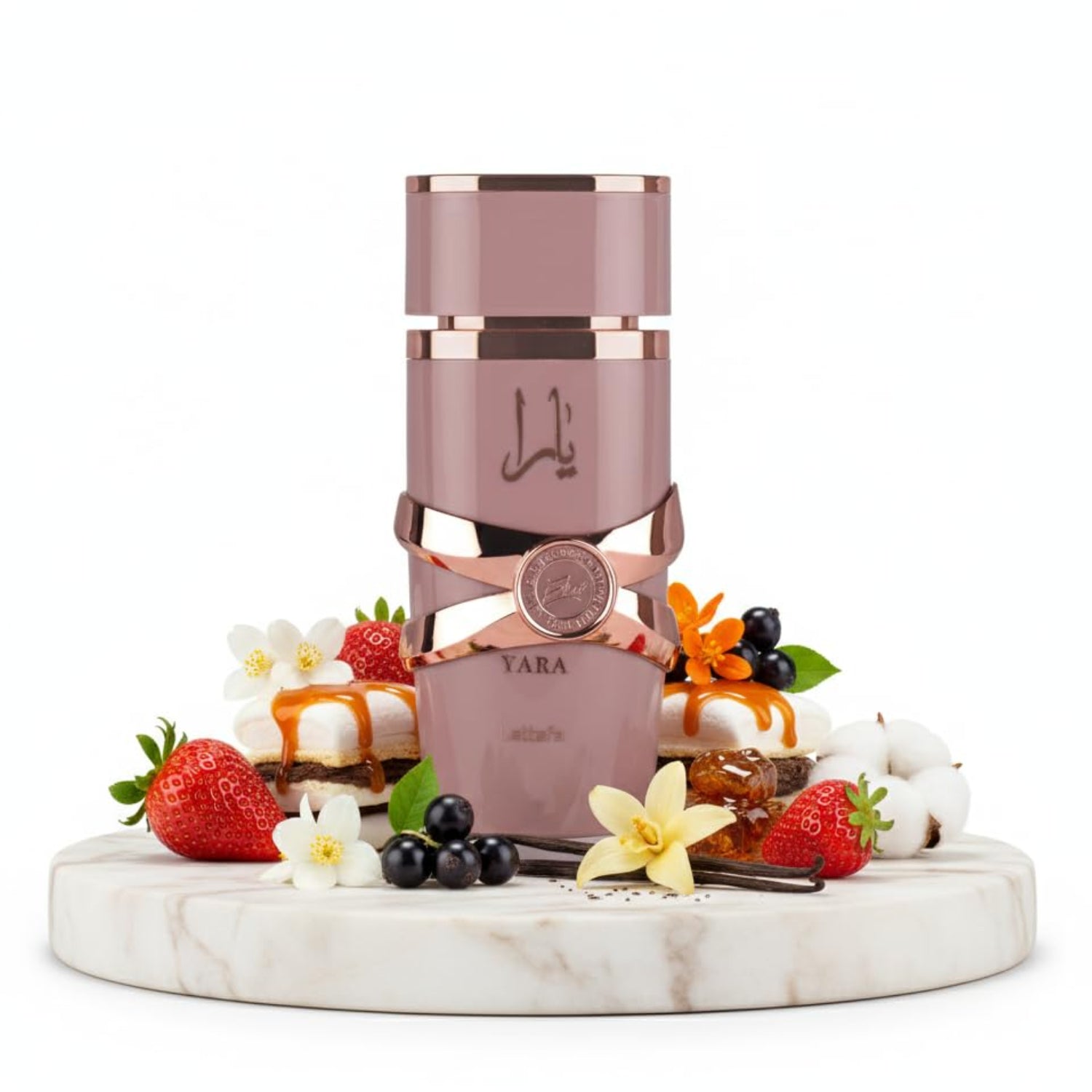 Pink and rose gold perfume bottle on a marble platform with fruits and flowers