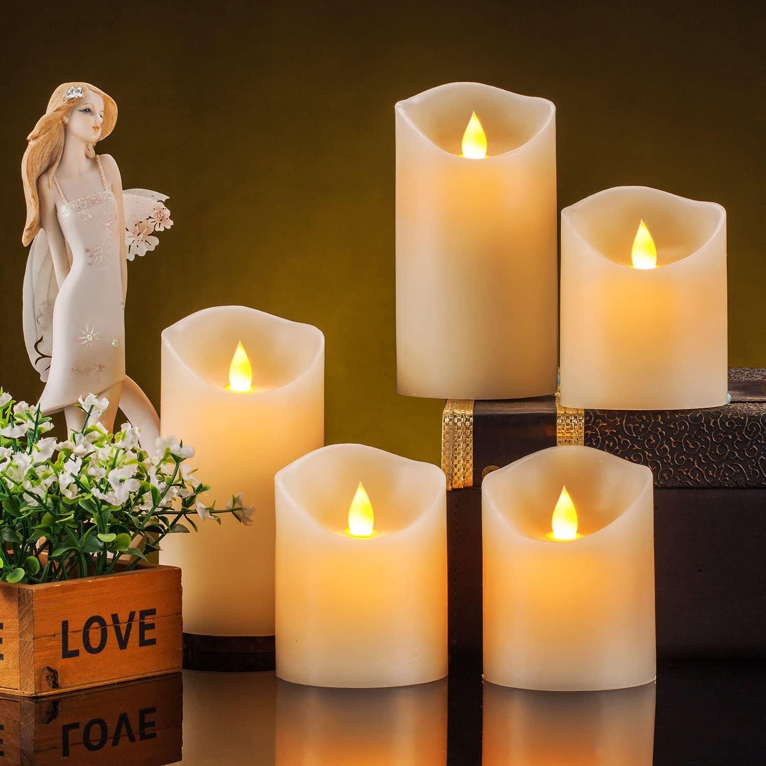 Set of five Enpornk flameless LED candles with flickering moving flames, creating a warm, realistic candlelight effect.