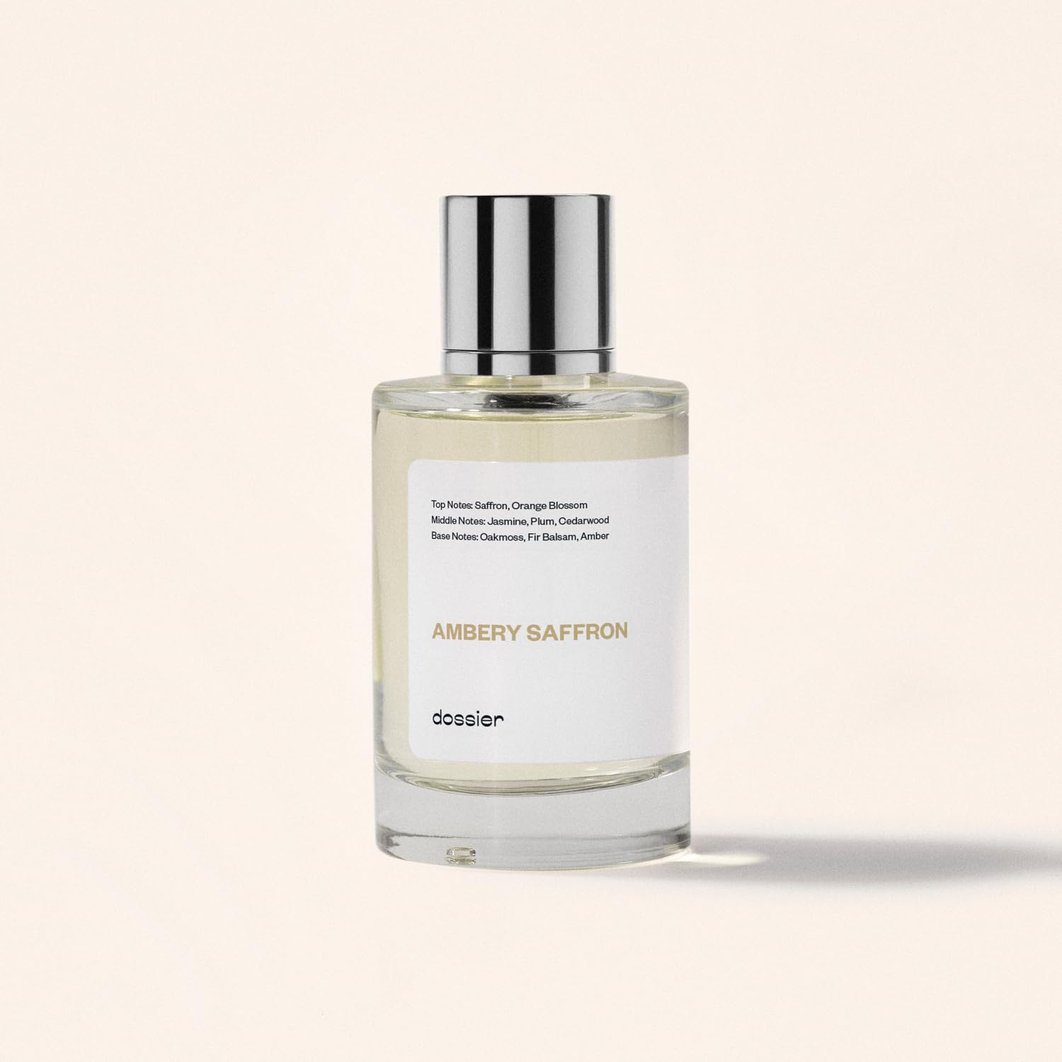 Dossier Ambery Saffron Eau de Parfum bottle with saffron-colored liquid, inspired by MFK Baccarat Rouge 540, vegan fragrance.