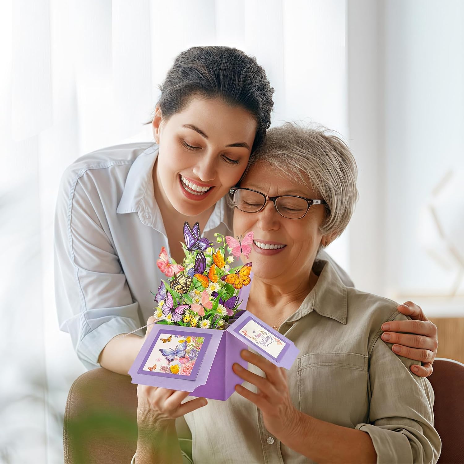 Hierein butterfly pop-up birthday card for women, colorful floral design, opens to reveal a festive birthday message.