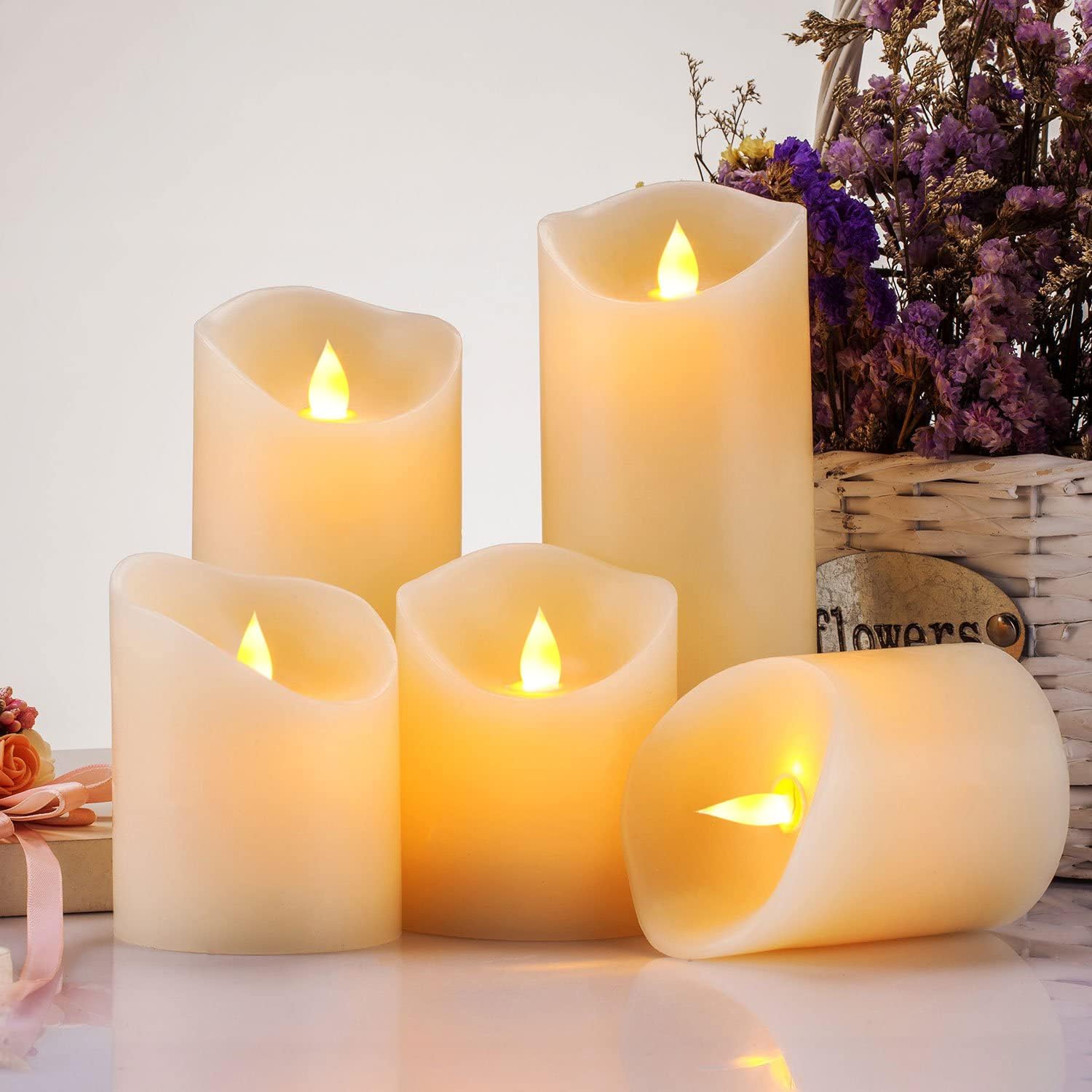 Set of five Enpornk flameless candles with flickering LED flames and realistic moving flame effect on white wax bases.