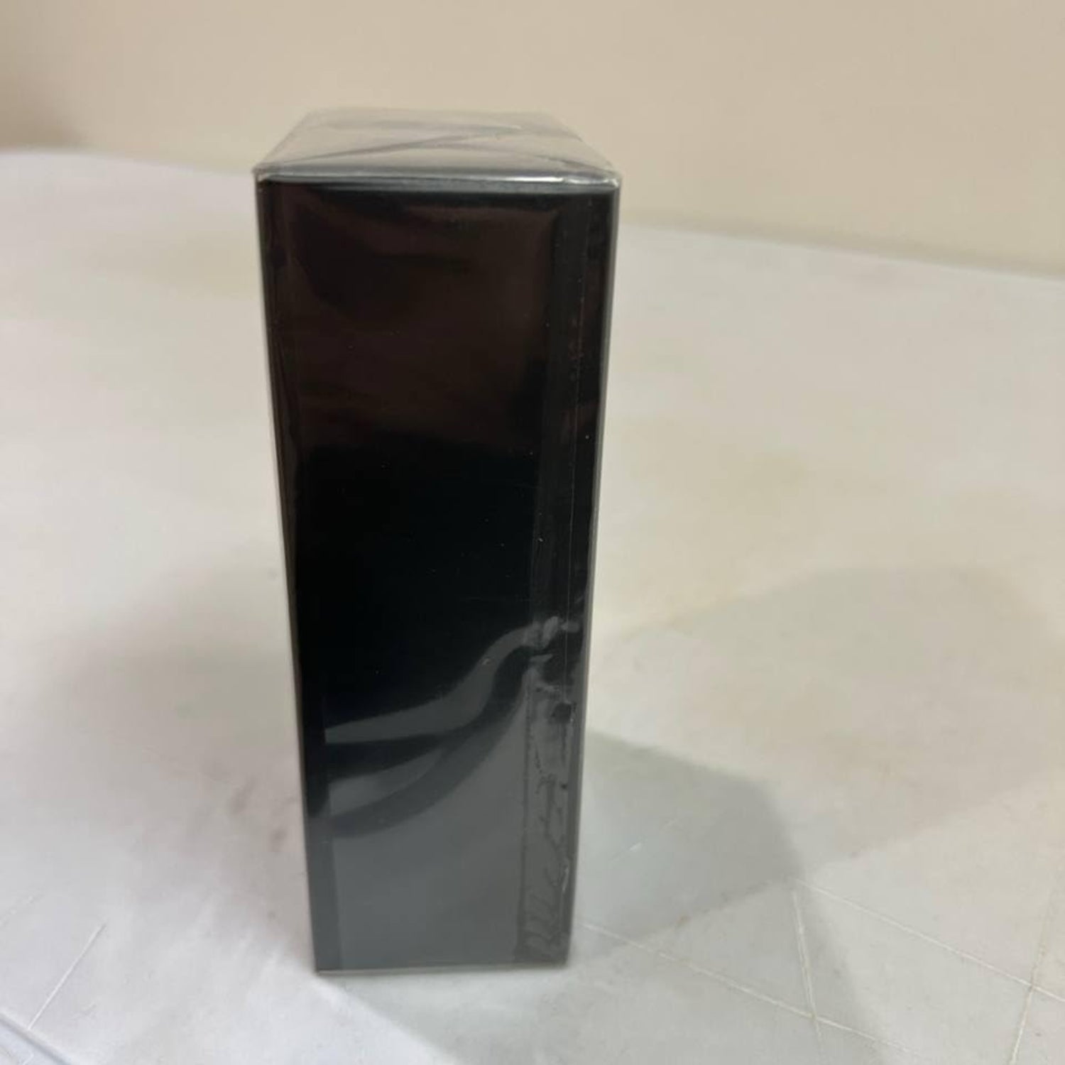 NovoGlow Novo Infinity men's eau de parfum spray bottle, 3.4 oz, with sleek packaging and elegant design.