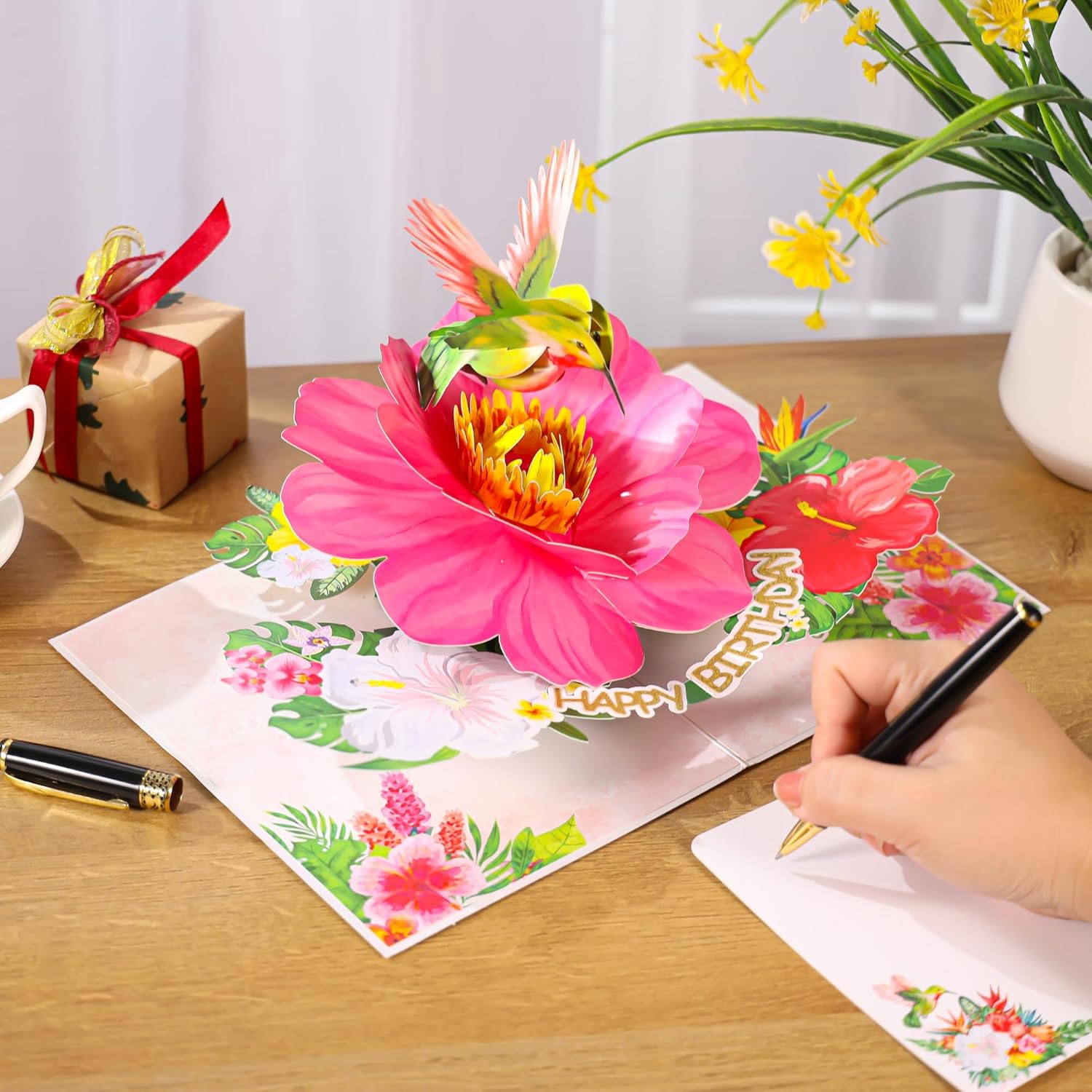 SISTIMON hummingbird pop-up birthday card for women featuring a colorful hummingbird perched on vibrant flowers inside.