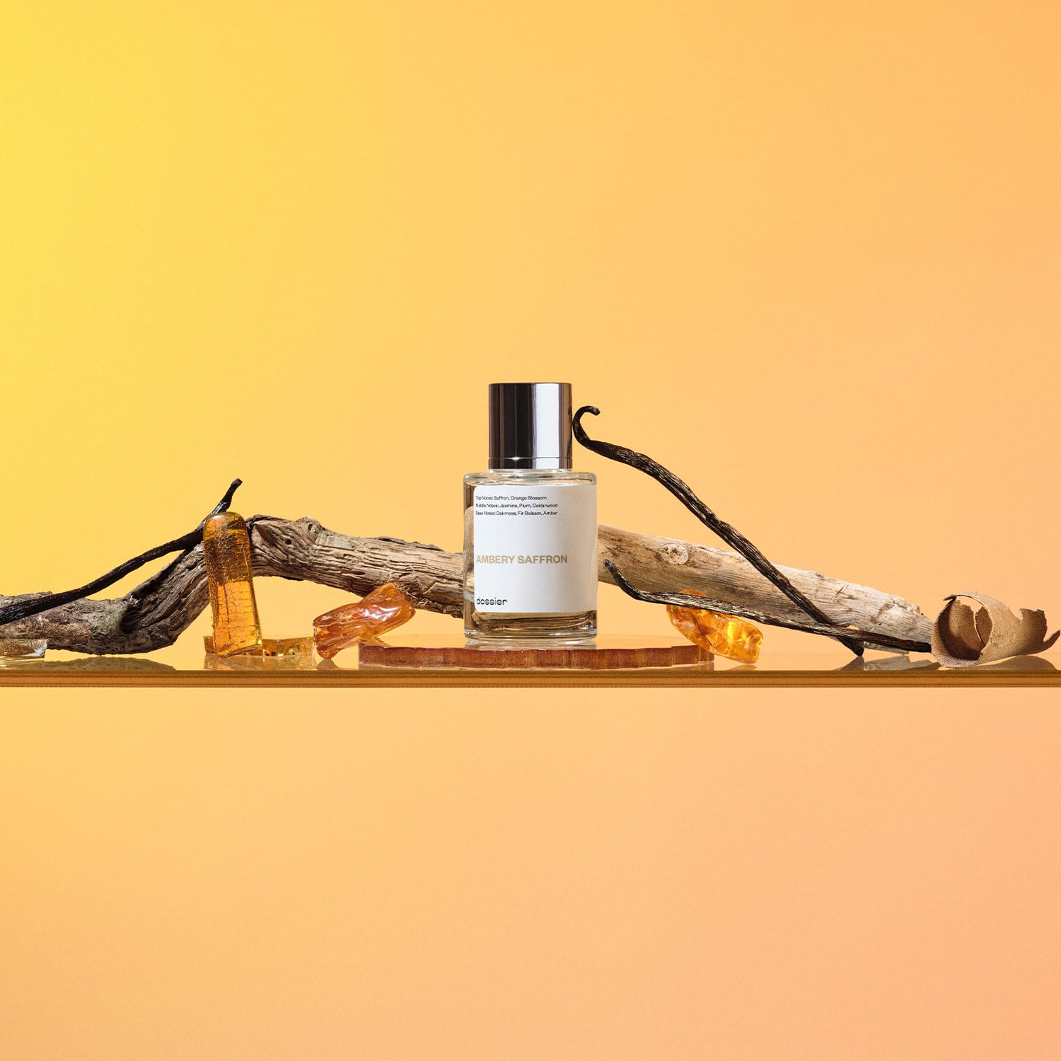 Dossier Ambery Saffron Eau de Parfum bottle with gold accents, inspired by MFK Baccarat Rouge 540, vegan fragrance.