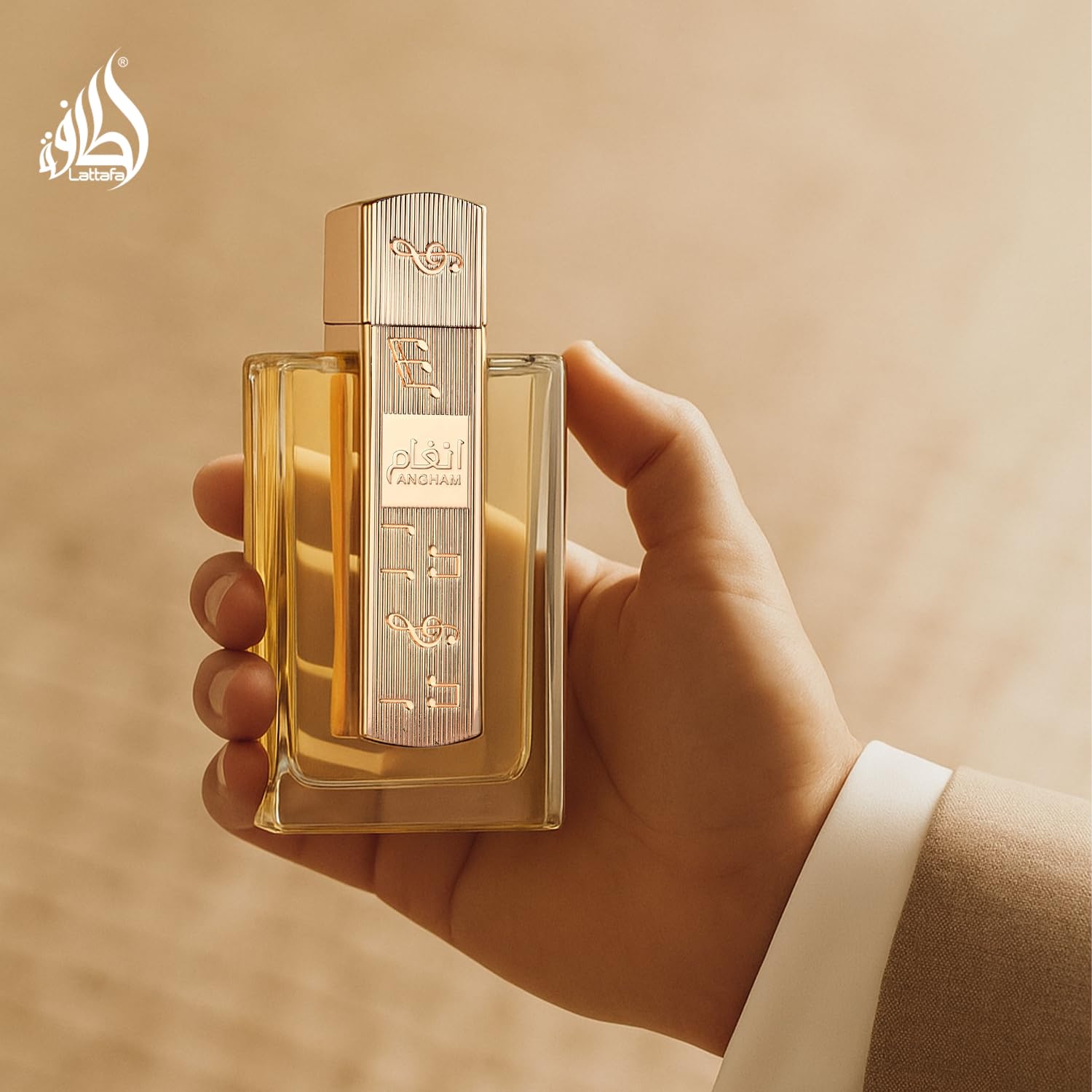 Lattafa Angham Eau de Parfum featuring citrus, lavender, musk, amber, and vanilla scent notes in a sleek perfume bottle.