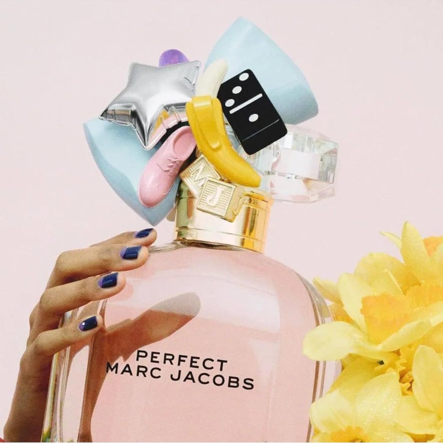 Marc Jacobs Perfect floral perfume bottle with notes of rhubarb and daffodil, elegant design for women.