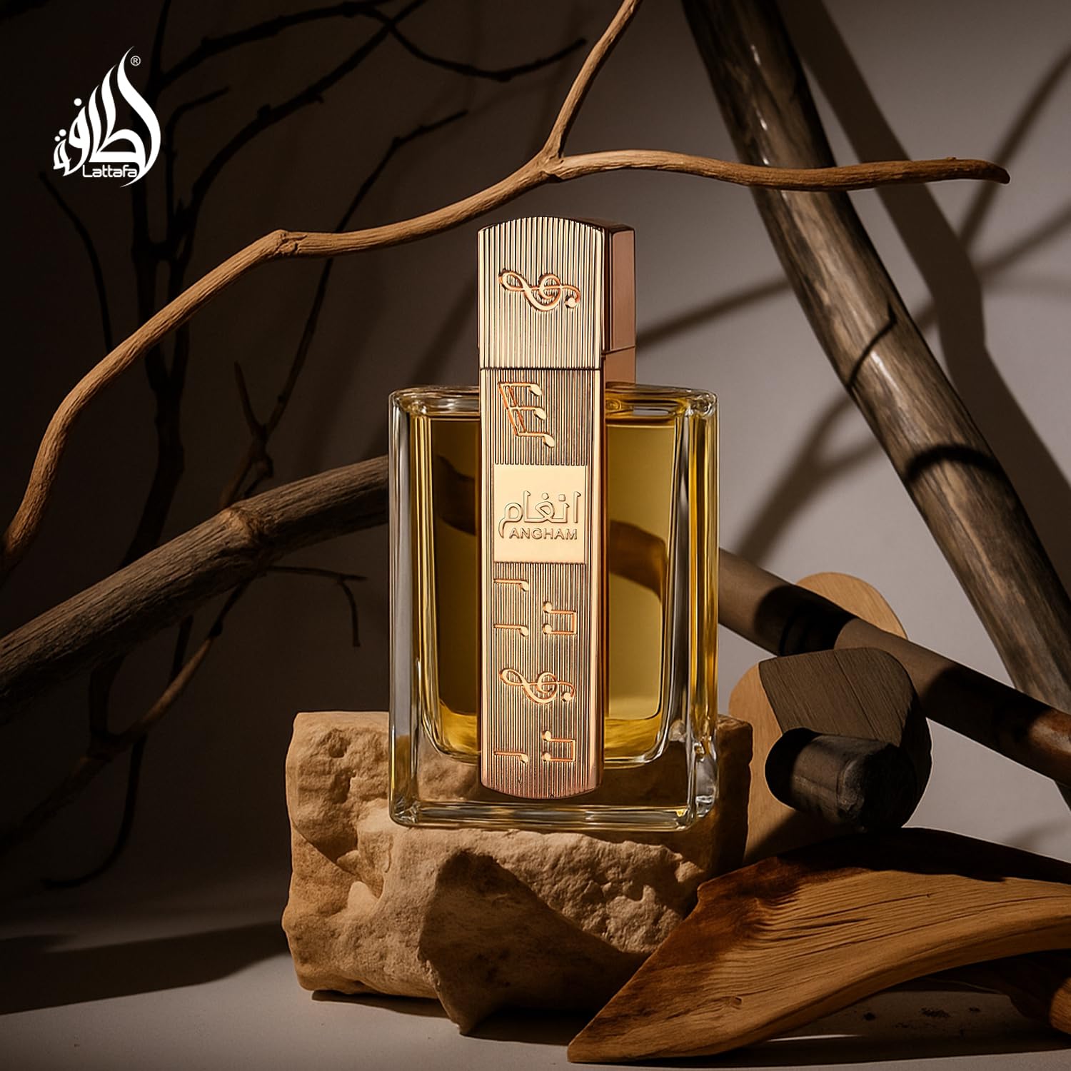 Lattafa Angham Eau de Parfum bottle featuring citrus, lavender, musk, amber, and vanilla notes on a neutral background.