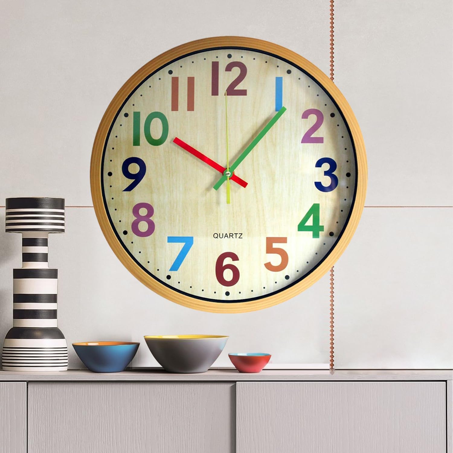Colorful 12-inch TOHOOYO wall clock with easy-to-read numbers, silent operation, and battery-powered design.