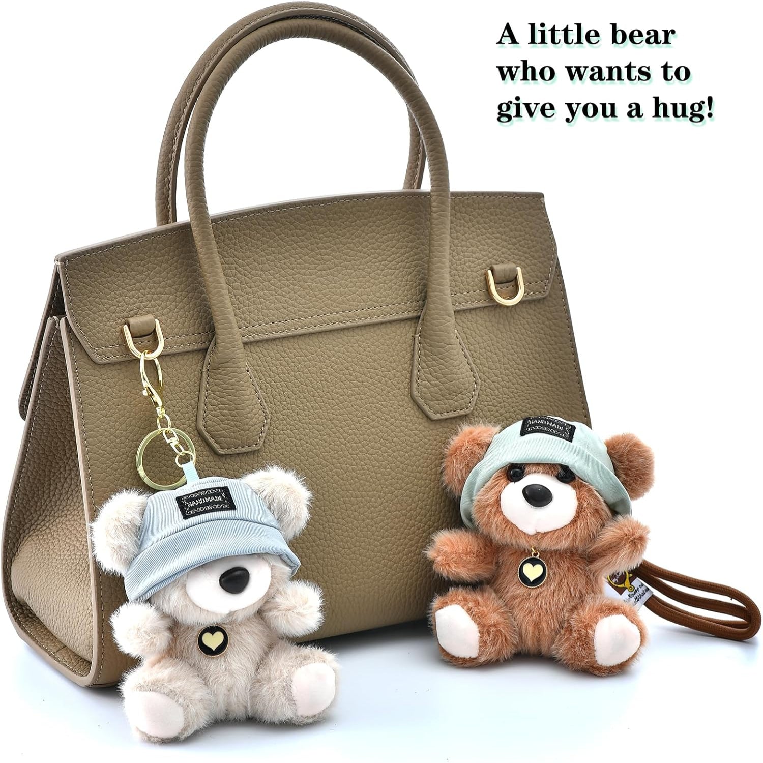 Brown handbag with teddy bear keychains wearing blue hats on a light gray background.
