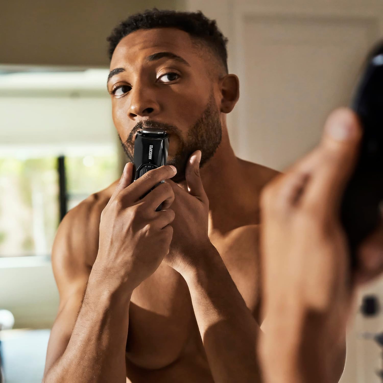 MANSCAPED The Beard Hedger men's premium beard trimmer with adjustable blade and ergonomic design.
